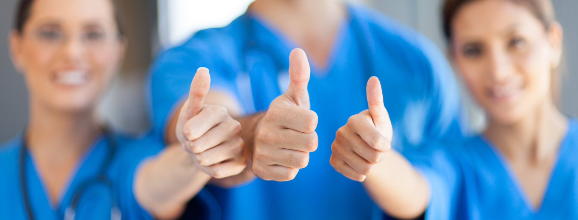 group of nurses doing a thumbs up